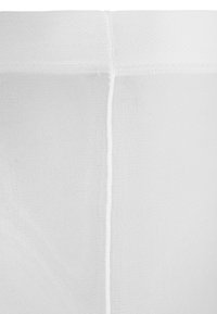 Leggings tricotés blancs avec une texture lisse, une taille élastique et une couture centrale courante verticalement à l'arrière.