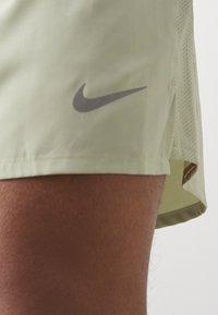 Nike Performance CHALLENGER SHORT - Sports shorts - olive aura/dark stucco/black/silver