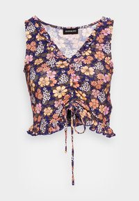 Květinový crop top v námořnické barvě s volánkovým výstřihem a lemem, s detaily na šňůrku uprostřed. Materiál vypadá lehký a texturovaný.