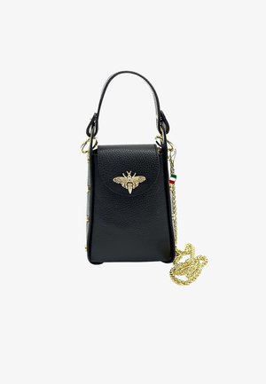 Small black leather handbag with gold bee emblem on flap, short handle, and long gold chain strap with Italian flag charm.