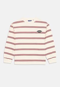 Long-sleeve striped sweatshirt in cream and maroon, featuring a round logo patch labeled "CHAMPION" on the left chest. Soft cotton fabric.