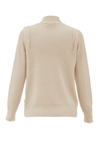 Maglione a coste beige con maniche lunghe e colletto alto. Presenta una vestibilità comoda e dettagli sulle spalle, con una trama morbida.