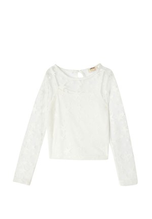 Haut à manches longues blanc avec un motif étoilé en transparence, col rond et détail en trou de serrure au dos. Le tissu léger crée un look texturé.