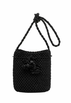 Black woven bucket bag with tassel decoration and a twisted shoulder strap looped at the top.