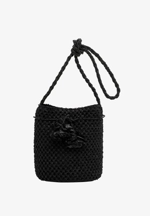 Black woven bucket bag with tassel decoration and a twisted shoulder strap looped at the top.