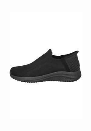 Zapatillas negras de tipo slip-on con parte superior de malla transpirable, parte trasera texturizada y suela de goma acolchada para mayor comodidad y flexibilidad.