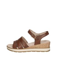 Sandali wedge in pelle marrone con cinturini incrociati, fibbia regolabile e suola intermedia dalla texture in sughero, dotati di suola in gomma per una maggiore aderenza.
