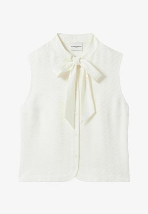 Blusa bianca senza maniche con un nodo al collo, caratterizzata da un motivo testurizzato, chiusura frontale con bottoni e un design classico del colletto.
