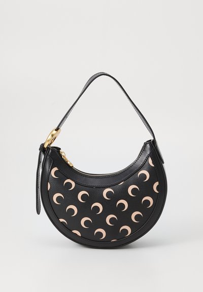Black leather handbag with a curved shape, featuring a beige crescent moon pattern, gold hardware, and a short strap. Zipper closure at the top.