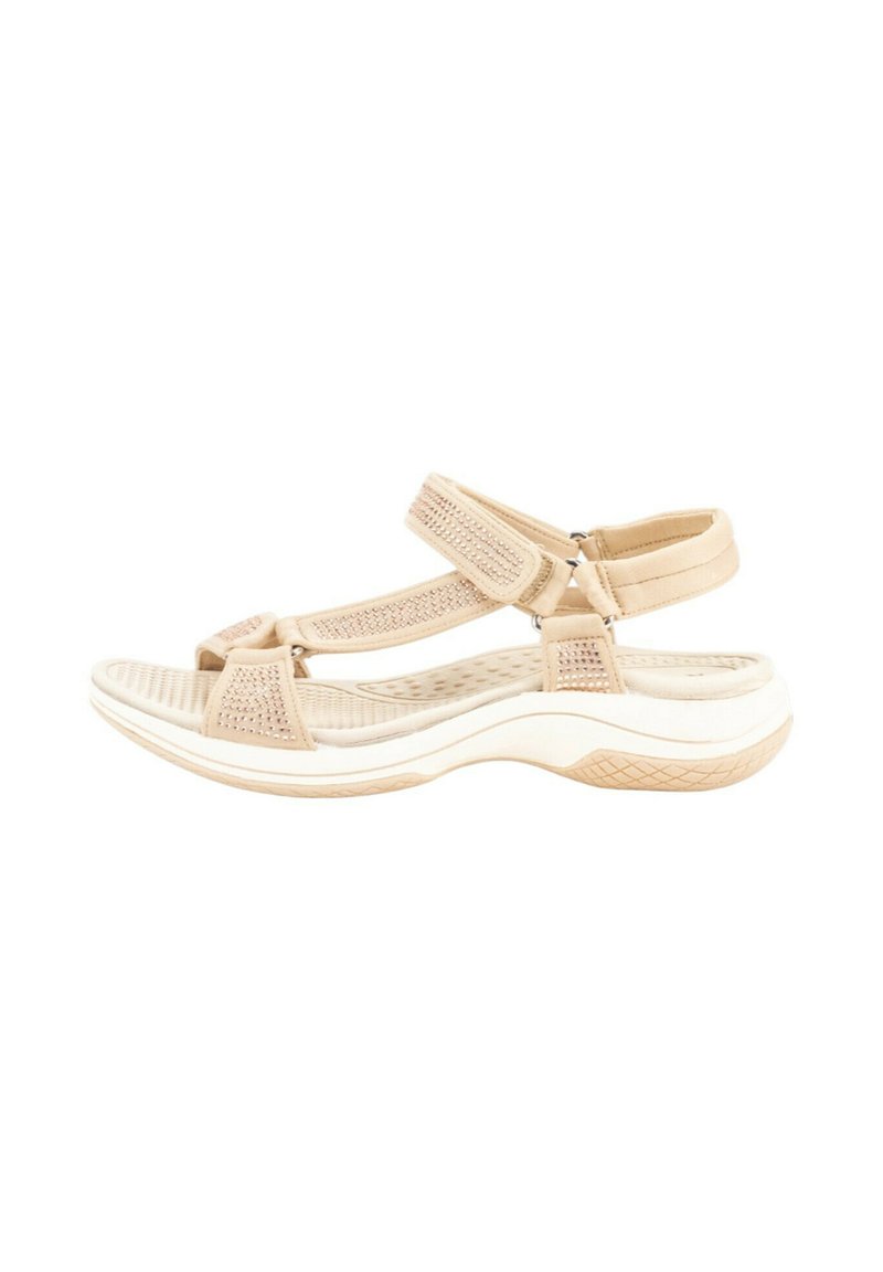 Sandalias deportivas beige con correas de malla y texturizadas, hebillas ajustables y suela blanca acolchada con patrón antideslizante.