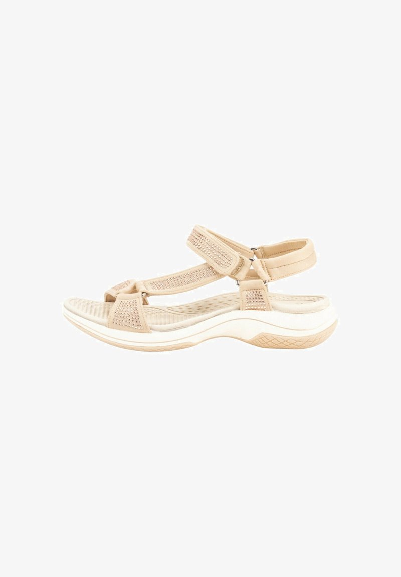 Sandalias deportivas beige con correas de malla y texturizadas, hebillas ajustables y suela blanca acolchada con patrón antideslizante.