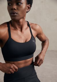 Puma KEEPS ULTRABARE STRAPPY - Vidutiniškai krūtinę prilaikanti sportinė liemenėlė - puma black