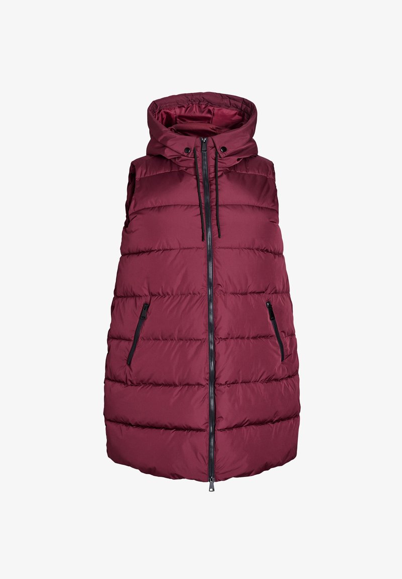 Tumši sarkans pūkains veste ar kapuci, izstrādāta ar vertikāliem kvadrātveida šuvumiem, priekšējo rāvējslēdzēju un divām sānu kabatām ar rāvējslēdzējiem. Viegls materiāls.