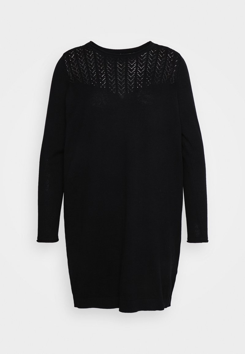 Robe en tricot noire à manches longues avec un empiècement transparent à motif chevron sur le haut de la poitrine et les épaules.
