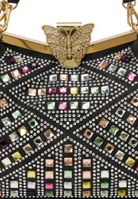 Black handbag adorned with multicolored square and round rhinestones, featuring a gold butterfly clasp and decorative textured surface.