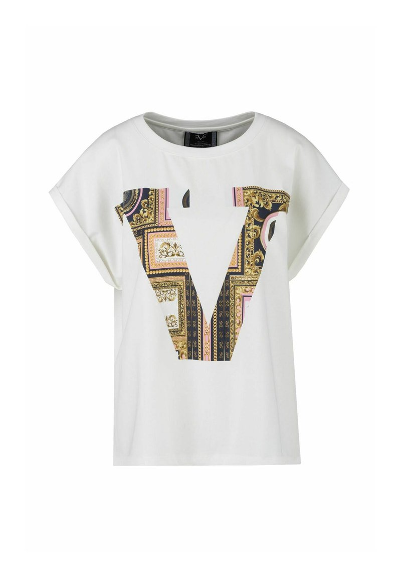 White short-sleeve t-shirt featuring a large patterned "V" graphic in gold, pink, and black, with a smooth, cotton-like texture.