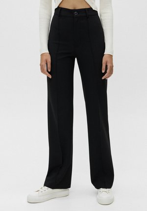 MIT ZIERNAHT VORNE - Trousers - black