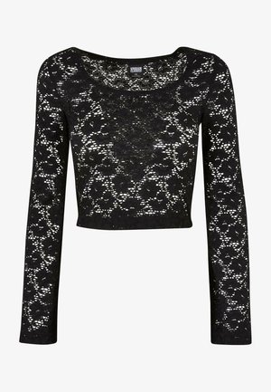 Fekete csipkés cropped felső hosszú ujjakkal. Virágmintás, kerek nyakkivágással és félátlátszó textúrával rendelkezik. Puha, könnyű anyag.