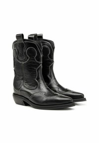 Mustad musta nahast kauboisaapad, teravate varvastega, keeruka valge tikandiga ja tõmblukkudega. Sile tekstuur, tugeva madala kontsaga.