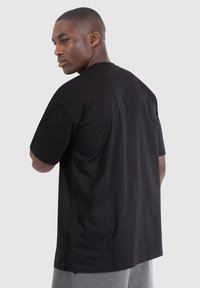 Smilodox BLAKE - Printtipaita - schwarz
