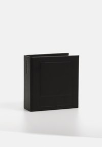 Black leather book with a rectangular shape, featuring a textured surface and a subtle embossed design on the cover.