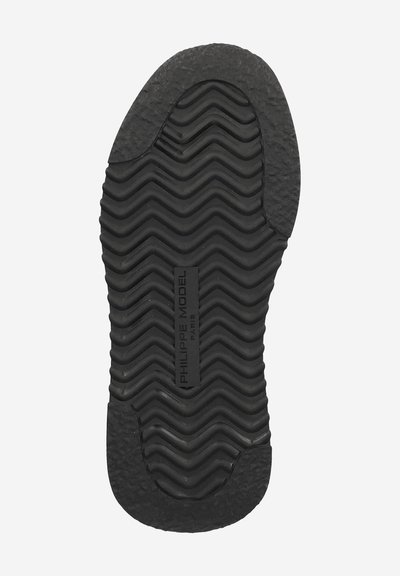 Black shoe sole with wavy tread pattern and textured heel and toe areas, featuring "PHILIPPE MODEL PARIS" branding in the center.
