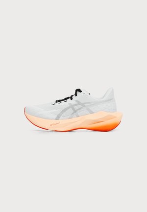 White running shoe with black laces and thick gradient orange sole labeled FF Turbo² shown from the side on a light background.