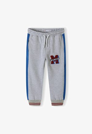 Gray sweatpants with blue side stripes and red accents. Features an embroidered "M" patch and elastic waistband with drawstring.