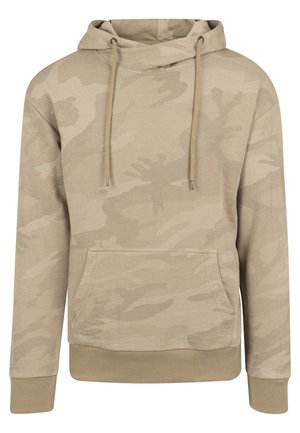 Beige kamuflaažiga kapuutsiga jakk, millel on kinnituspaelad, eesmine tasku ja soonikkoes mansetid. Pehme kangas, millel on sile tekstuur ja peen muster.