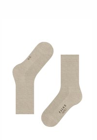 Calzini in misto cotone beige con texture a coste, dotati di tallone e punta rinforzati. Nome del marchio stampato sulla suola.