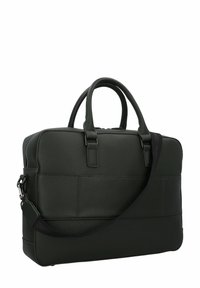 Sac en cuir vert foncé à surface texturée, avec deux poignées et une bandoulière amovible. Dispose d'une fermeture éclair et d'une poche avant.