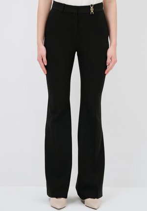 FLOURE - Trousers - black