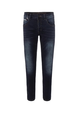 Donkerblauwe slim-fit jeans met voorzakken, ceintuurlussen en licht vervaagde details op dijen en knieën, afgebeeld tegen een witte achtergrond.