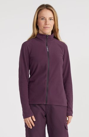 Paarse fleecejack met hoge kraag en volledige rits. Glad textuur en slimfit ontwerp, gecombineerd met bijpassende paarse broek.