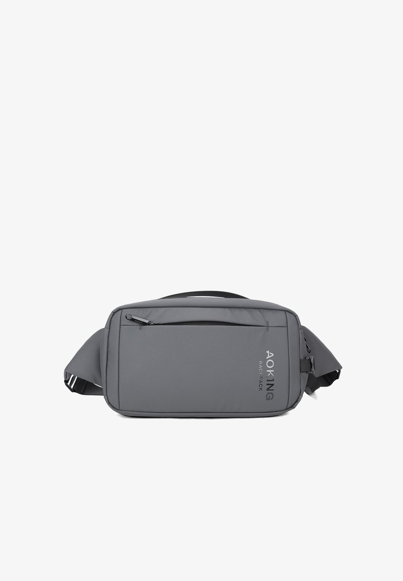 Borsa a spalla grigia realizzata in materiale resistente, dotata di una tasca anteriore con cerniera, tracolla regolabile e branding discreto sul lato.