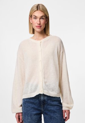 Cream, fluffy cardigan with a round neckline, full sleeves, and button closure. Features a loose fit and textured fabric.