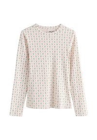 Haut à manches longues, rose clair avec un motif floral subtil en vert et rouge. Tissu doux, col rond et coupe décontractée.