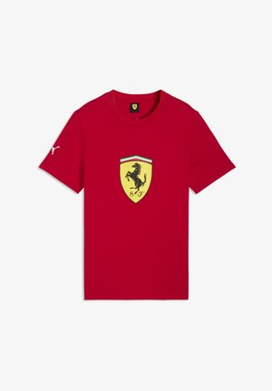 Red short-sleeve t-shirt with yellow Ferrari shield and black prancing horse emblem centered on chest and white Puma logo on right sleeve.