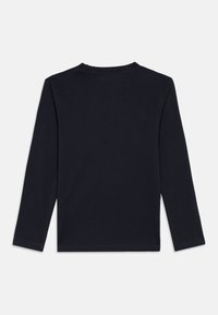 Plain black long-sleeve crew neck shirt shown from the back on a white background.
