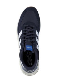 Navy athletic shoe with mesh and textile upper, three white stripes, blue tag, padded collar, and rubber sole with gray accents.