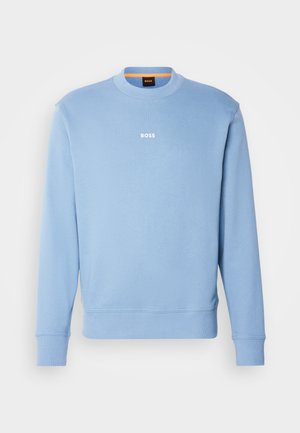 Light blue sweatshirt with crew neck, ribbed cuffs, and hem. Features a white "BOSS" logo on the chest. Made of soft, textured fabric.
