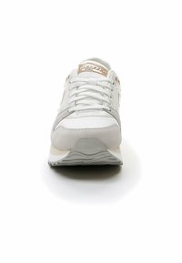 White athletic shoe with a mesh upper, white and grey suede accents, and a textured beige sole. Features laces and a gold logo detail.