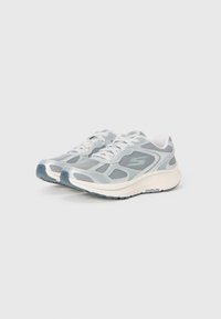 Pair of gray and white Skechers GOrun running shoes with mesh upper and lace-up fastening viewed from front side.