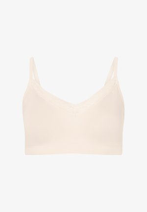 Lichtbeige bralette van soepel, rekbaar materiaal. Het V-halsontwerp heeft een kanten afwerking langs de randen en dunne verstelbare straps.