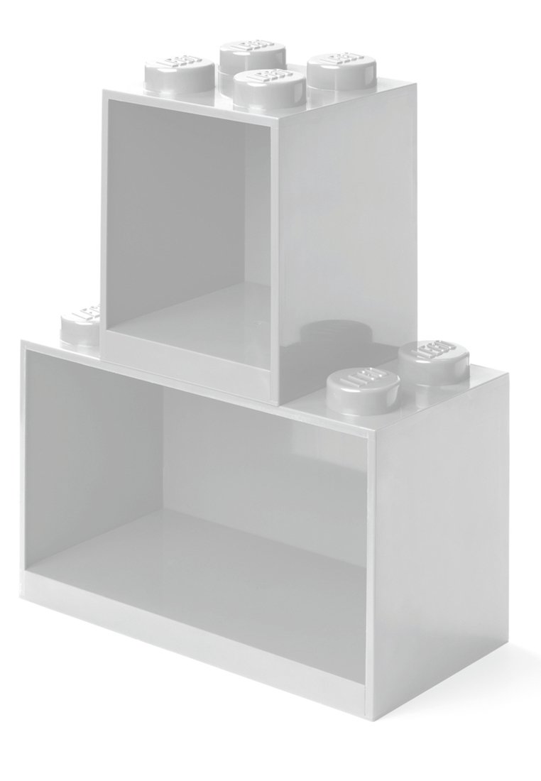 Bloques de almacenamiento de LEGO de plástico blanco con una superficie lisa, bordes redondeados, estructura hueca y parte superior con puntos para apilar.