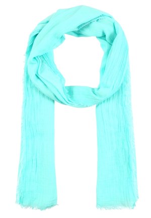 Écharpe en tissu doux bleu clair avec une texture verticale subtile, bouclée librement avec des bords effilochés aux deux extrémités.
