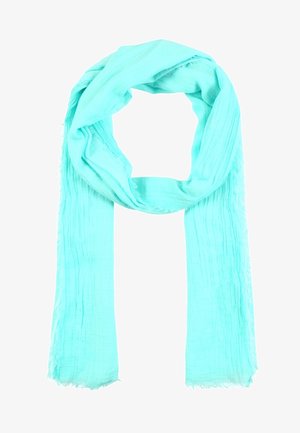 Écharpe en tissu doux bleu clair avec une texture verticale subtile, bouclée librement avec des bords effilochés aux deux extrémités.