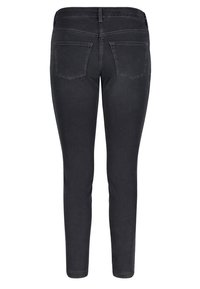Jeans skinny negros con una textura suave, que presentan una cintura de altura media, dos bolsillos traseros y detalles de costura mínimos.