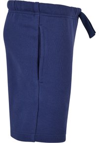 Marineblå svettshorts med elastisk midje og snøring. Har en sidelomme og et mykt, strukturert stoff for komfort.