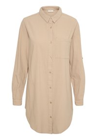 Chemise beige à manches longues avec un col boutonné, une poche avant et un ourlet arrondi. Fabriquée en tissu léger et texturé.